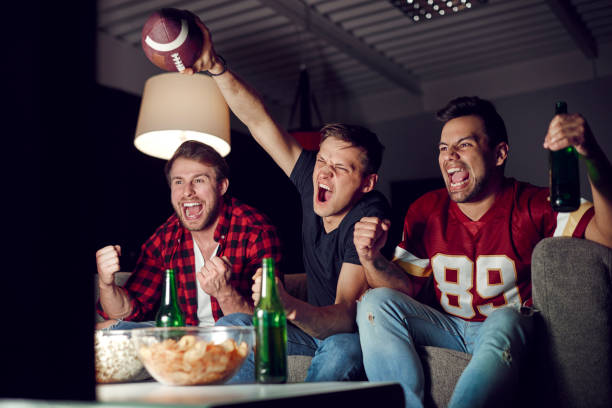 istock Football fans shouting and gesturing 910507418