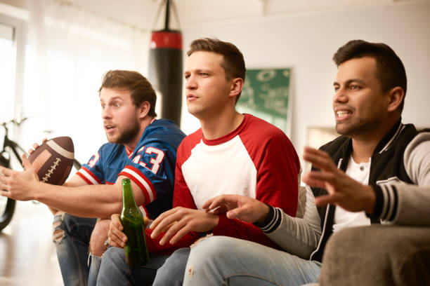 istock Unhappy men while watching american football 910507570