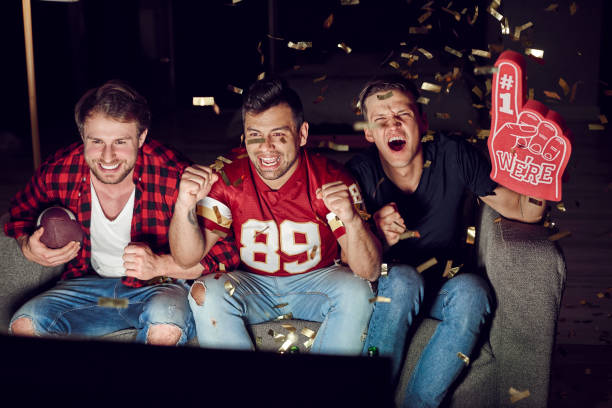 istock Loyal football fans supporting their team 910507756