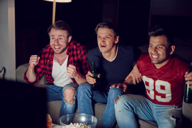 istock Guys in anticipation of next score 910511804