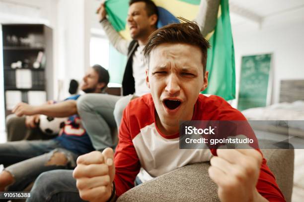 Fan Is Disappointed With Soccer Game Stock Photo - Download Image Now - Fan - Enthusiast, Television Set, Screaming
