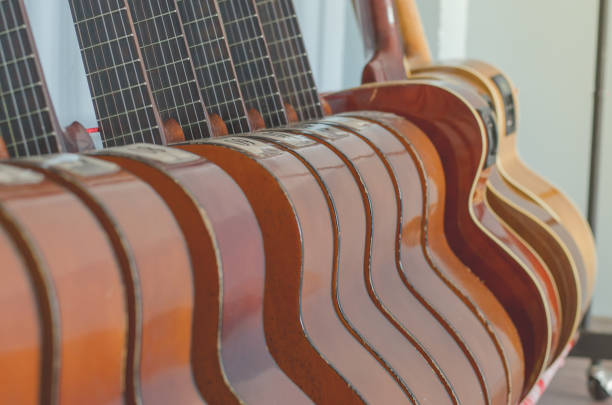istock Acoustic Guitar Classical  neck object old in room 910517576