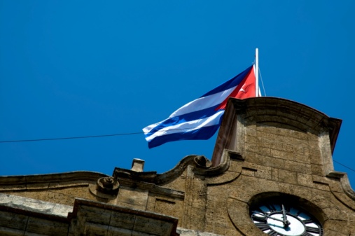 Cuban Flag flying over an old building in Havana, Cuba.