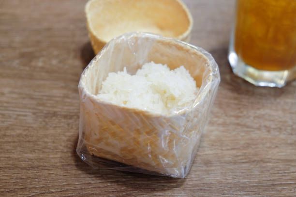 istock Sticky rice in sticky rice box on wooden table 910524908