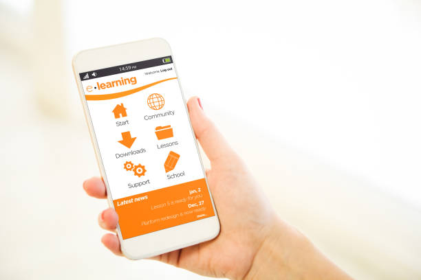 Woman holding a pink gold blank smartphone showing e-learning mobile platform