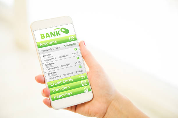 istock Woman holding a pink gold blank smartphone mobile banking 910535764