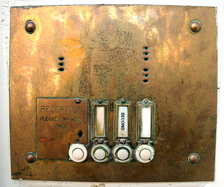 An exterior natural gas meter with an analog display mounted on the side of a building.
