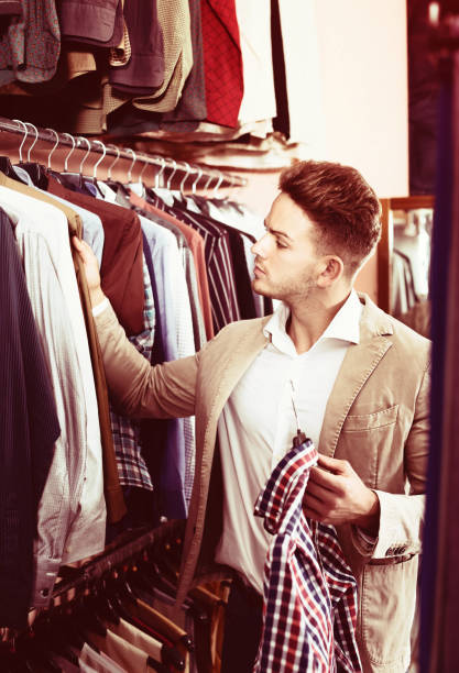 istock Man choosing new shirt 910538790