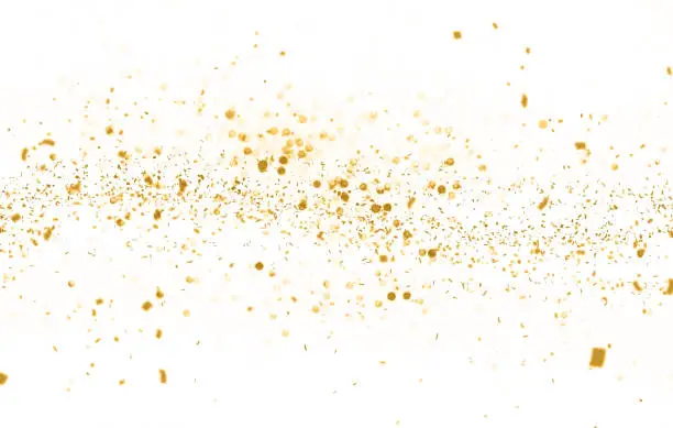 Photo of Waving golden glitter and confetti