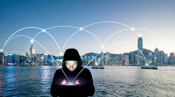 istock A man in black jacket playing with a cellphne 910543400