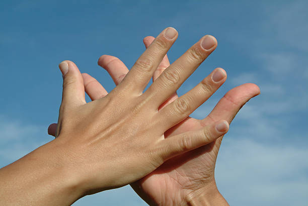istock Hands against sky, friendship concept 91054374