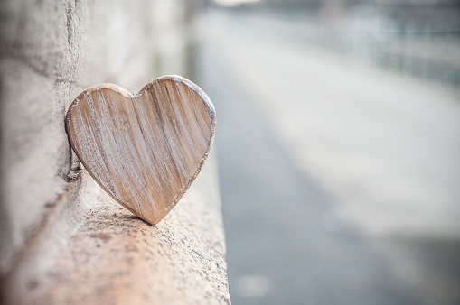 closeup of wooden heart in outdoor - Love concept