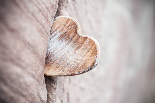 istock wooden heart on stoned wall - Love concept 910545998