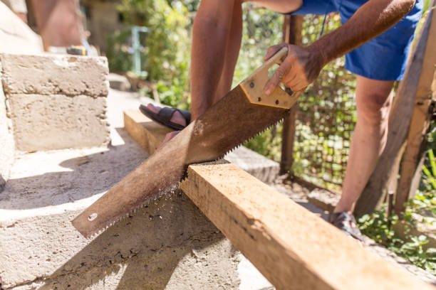istock A man is sawing a beam of wood 910547316