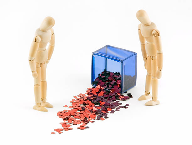 istock Two Mannequins Look at Spilled Box of Hearts 91055571