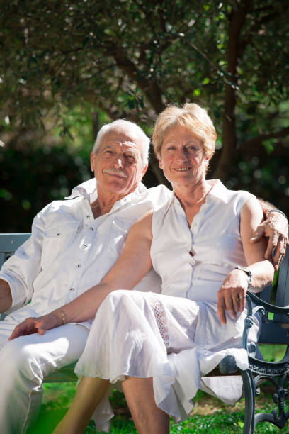 istock senior couples in a garden in the spring 910555978