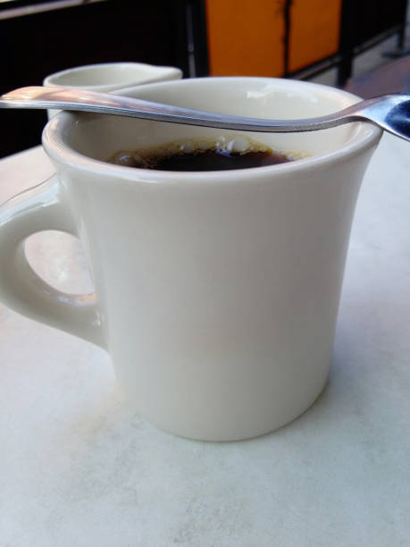 istock Cup of coffee in a diner 910556714