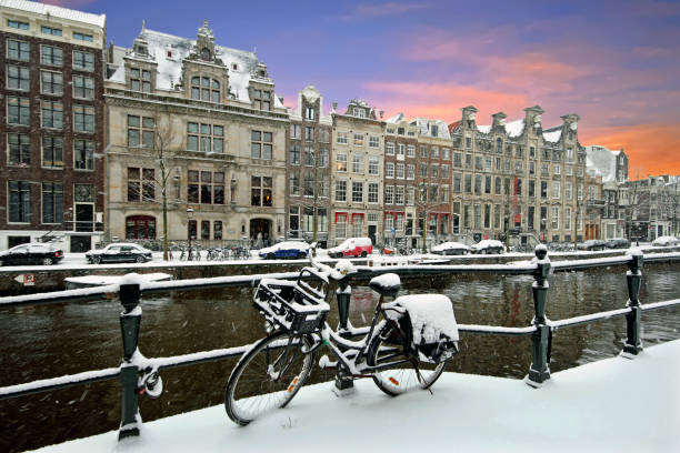 istock Amsterdam covered with snow  in winter in the Netherlands at sunset 910560554