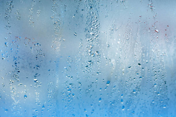 istock Natural water steam on glass. Blue drop texture 910560602