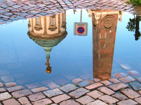 Krakow, Poland - frequent rainshowers make Old Town Krakow look like a mirror when it's full wet. Here in particular Market Square, a main landmark