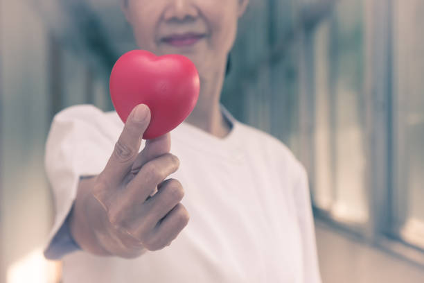 istock Nurse Holds Heart for Valentine's Day 910566946