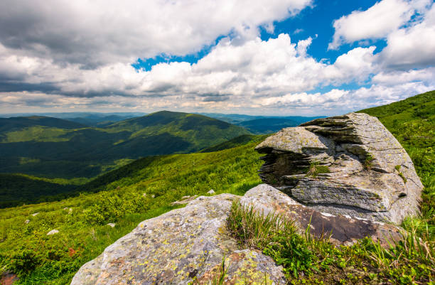 istock boulders on the grassy slope 910567750