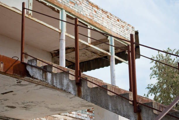 istock rusty railing on an abandoned building against the sky building site 910578570