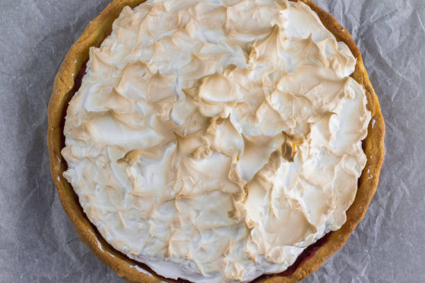istock Top view on Meringue cake with strawberry jam on baking paper 910585008