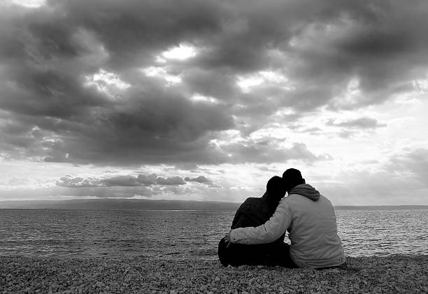 Cuddle on the beach stock photo