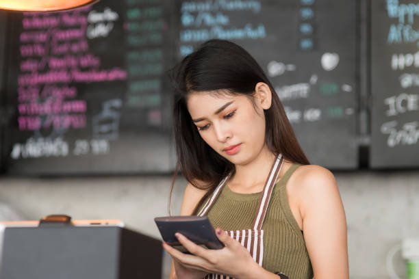 istock Young asian woman using tablet at cafe background, work concept. 910592876
