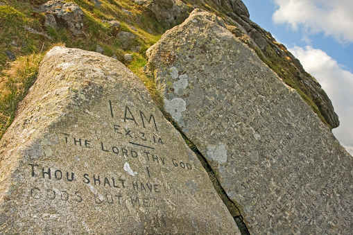 The ten commandments have been carved onto these pieces on granite stone at Buckland Beacon in 1928 to celebrate parliaments rejection on the then new book on common prayer.     