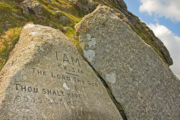 The ten commandments have been carved onto these pieces on granite stone at Buckland Beacon in 1928 to celebrate parliaments rejection on the then new book on common prayer.     