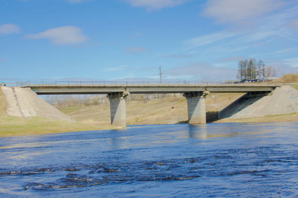 istock the road bridge across the river, 910602458