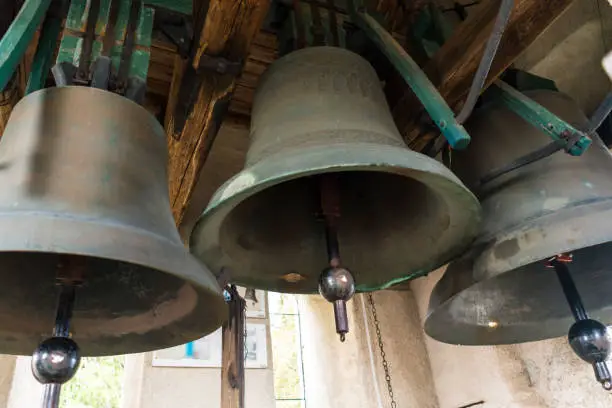 Three large church bells made of copper.