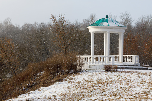 Gazebo in historical park, house of the nobility by a snowy day. Russia, Orel city