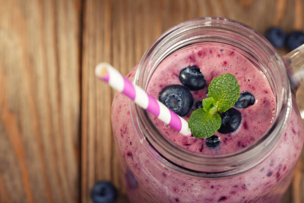 istock Smoothies with the addition of blueberries and mint. Space for text 910609526