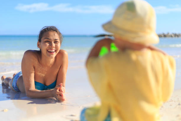 Mother and her baby boy are on a beach in the Dominicana Republic Mother and her baby boy are on a beach in the Dominicana Republic family beach vacations travel stock pictures, royalty-free photos & images