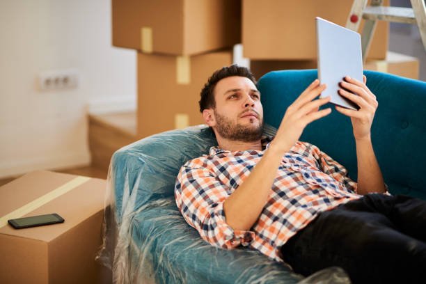 istock Man in new apartment 910623652