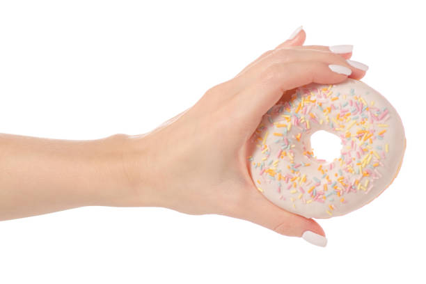 istock Donuts sweetness frosting in hand 910633472