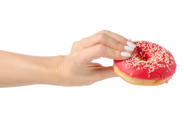 istock Donuts sweetness frosting in hand 910633500