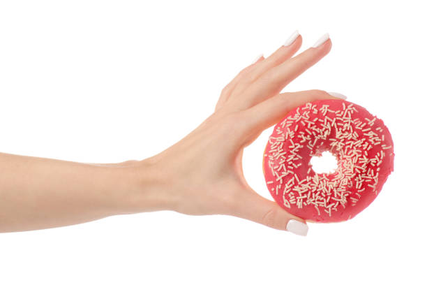 istock Donuts sweetness frosting in hand 910633540