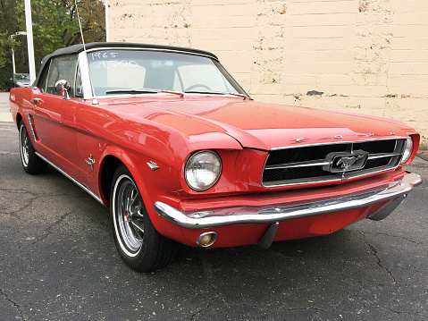 Franklin, Tennessee-October 25, 2015: Focus is on the front end of this classic 1965 Mustang convertible.