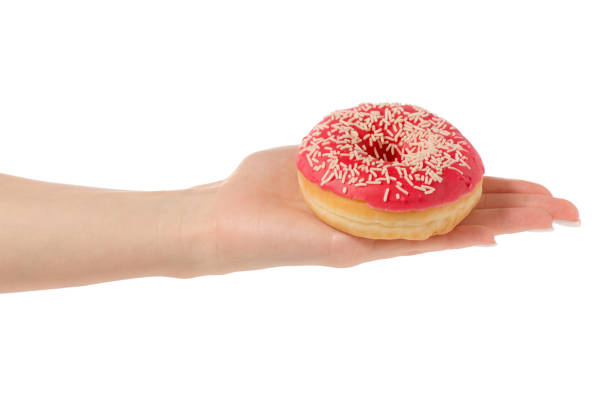istock Donuts sweetness frosting in hand 910633736