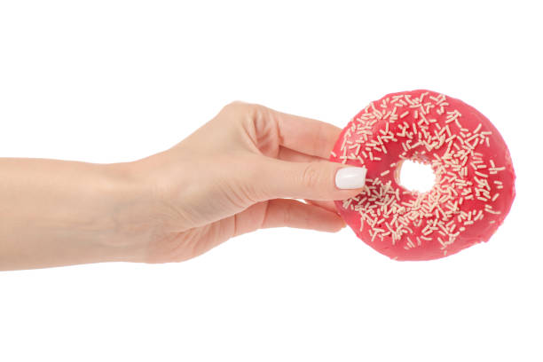 istock Donuts sweetness frosting in hand 910633874