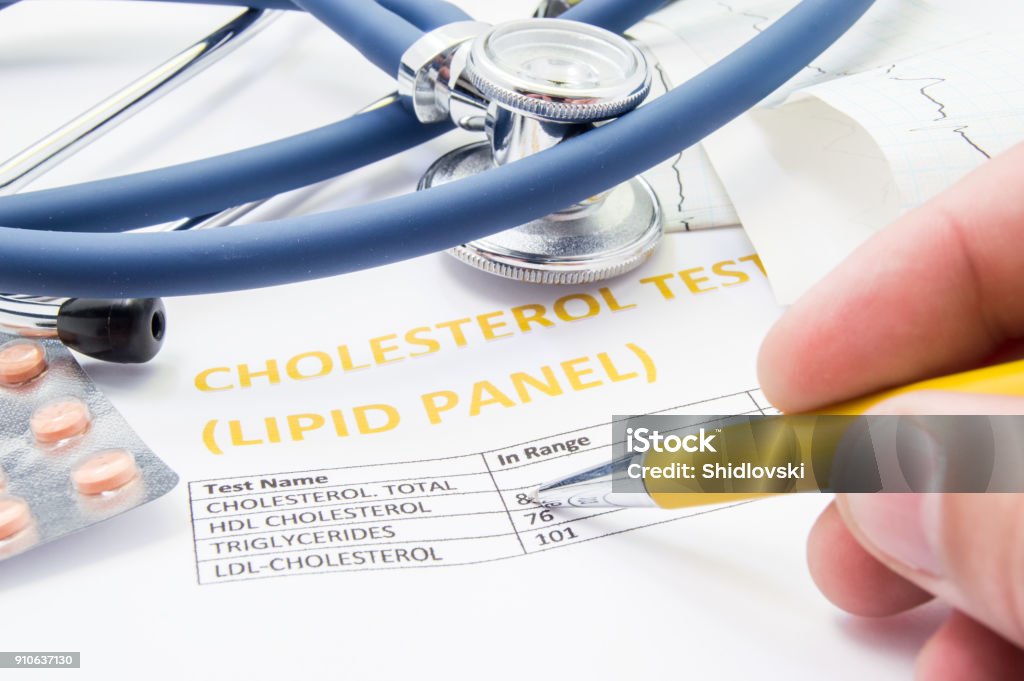 General practitioner checks cholesterol levels in patient test results on blood lipids. Statin pills, stethoscope, cholesterol test and hand of doctor, pointing to increasing its level in concept Cholesterol Stock Photo