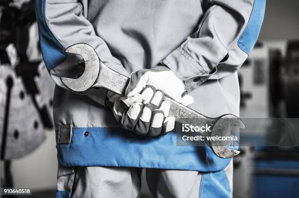 Machinery Mechanic On A Duty Stock Photo - Download Image Now - Wrench, Large, Repairing