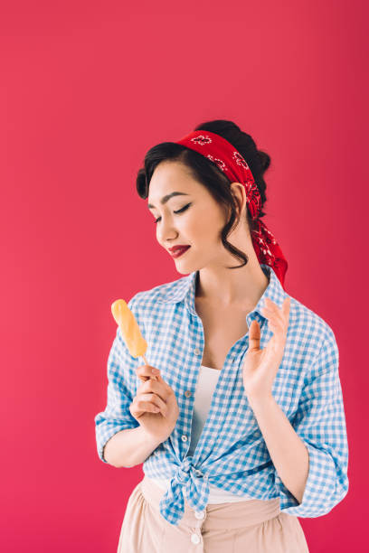 istock asian woman with popsicle 910643724
