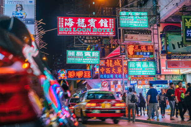 colorful neon night street road in hongkong with taxi - hong kong night china asia imagens e fotografias de stock