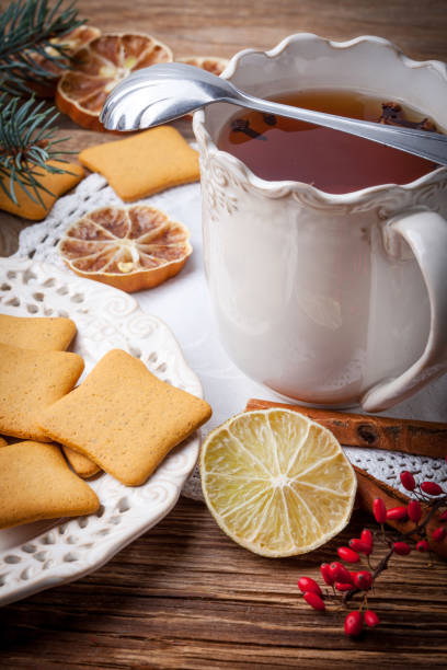 istock Winter hot drink with spices on wooden table. 910651342
