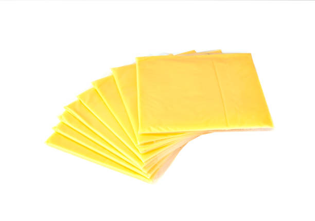 istock Slices of processed cheese on a white background. 910651760